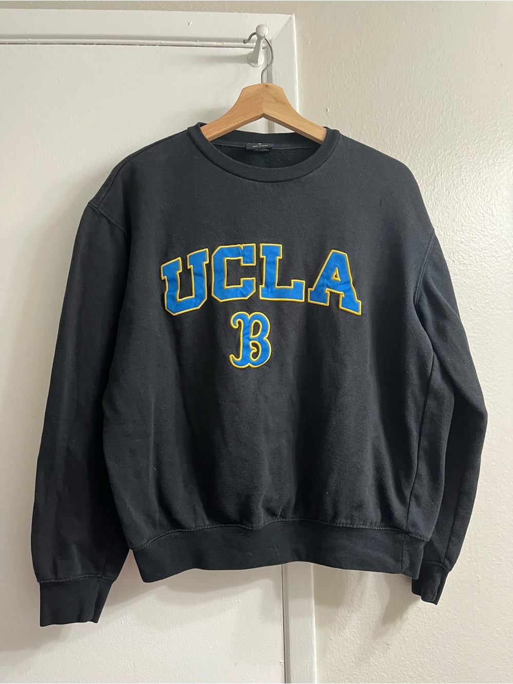 Colosseum Black Crewneck Sweatshirt with Blue & Yellow Lettering